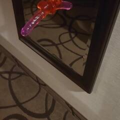 Fucking a big dildo against the wall