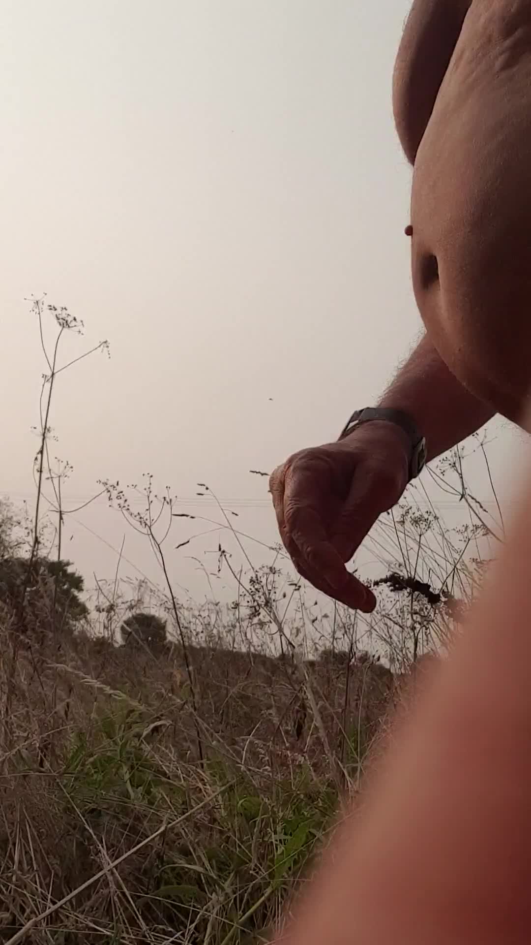 Pic #1He shows off his small penis in the forest.